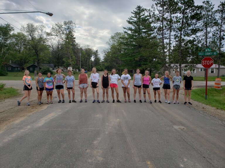 Cross country runners at road